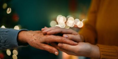 Elderly,Woman,Celebrating,Christmas,At,Home.,Old,Lady,And,Young.